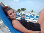 Kim lounging by pool in Mexico